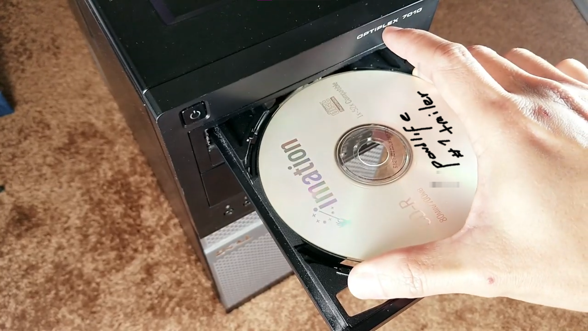 a thumbnail from the pondlife trailer showing the open cd tray of a computer tower